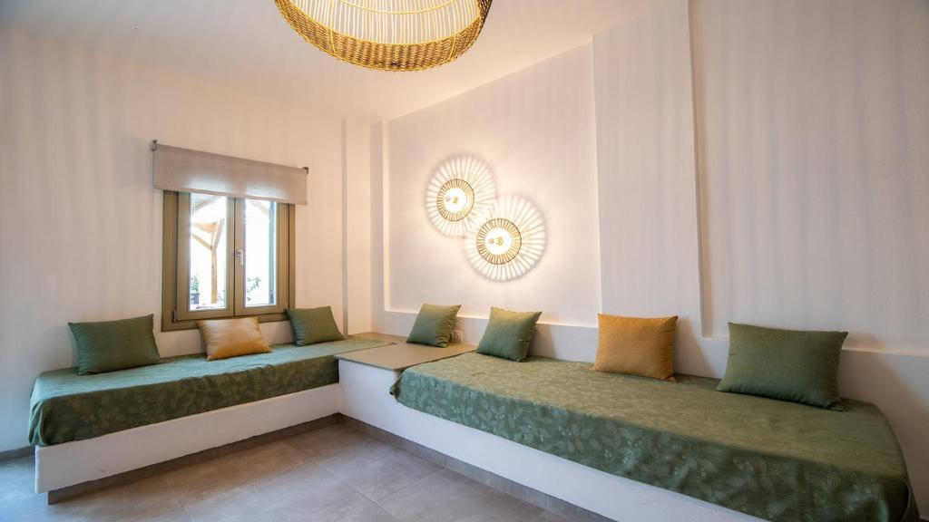 Posteľ alebo postele v izbe v ubytovaní Horto View Suites