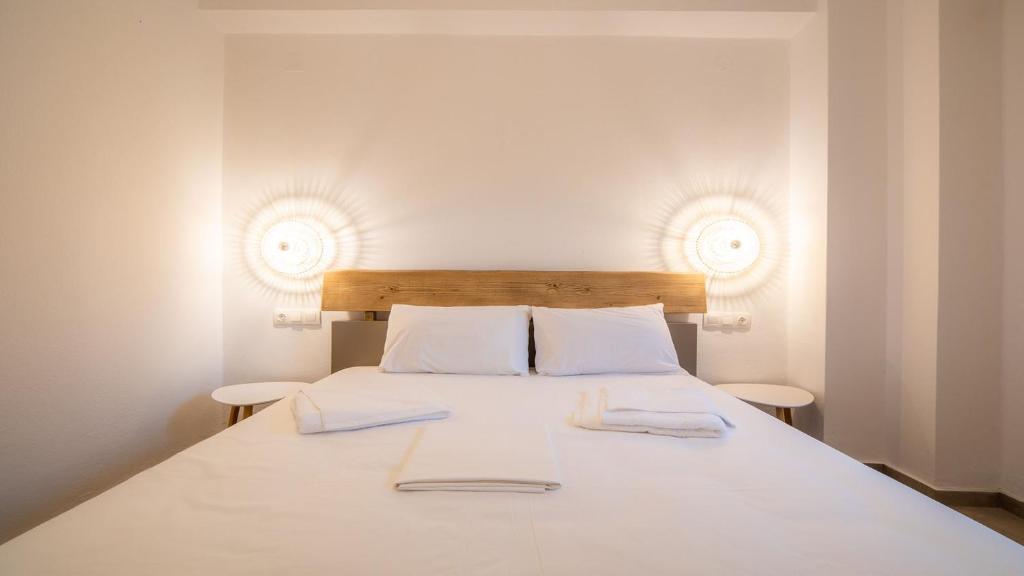 Posteľ alebo postele v izbe v ubytovaní Horto View Suites