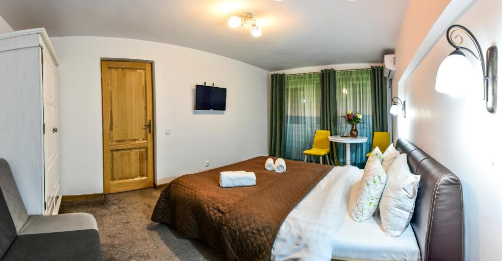 Postel nebo postele na pokoji v ubytování Noblesse House Deva