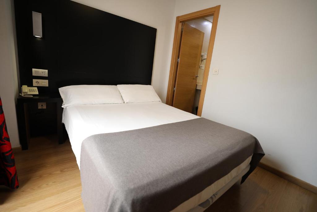 Postel nebo postele na pokoji v ubytování YIT Casablanca
