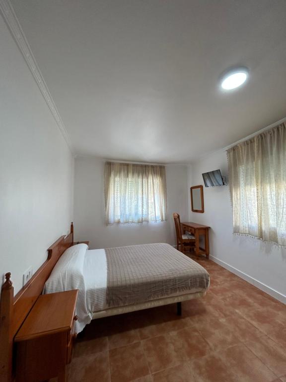 Ένα ή περισσότερα κρεβάτια σε δωμάτιο στο A Casa de Santos