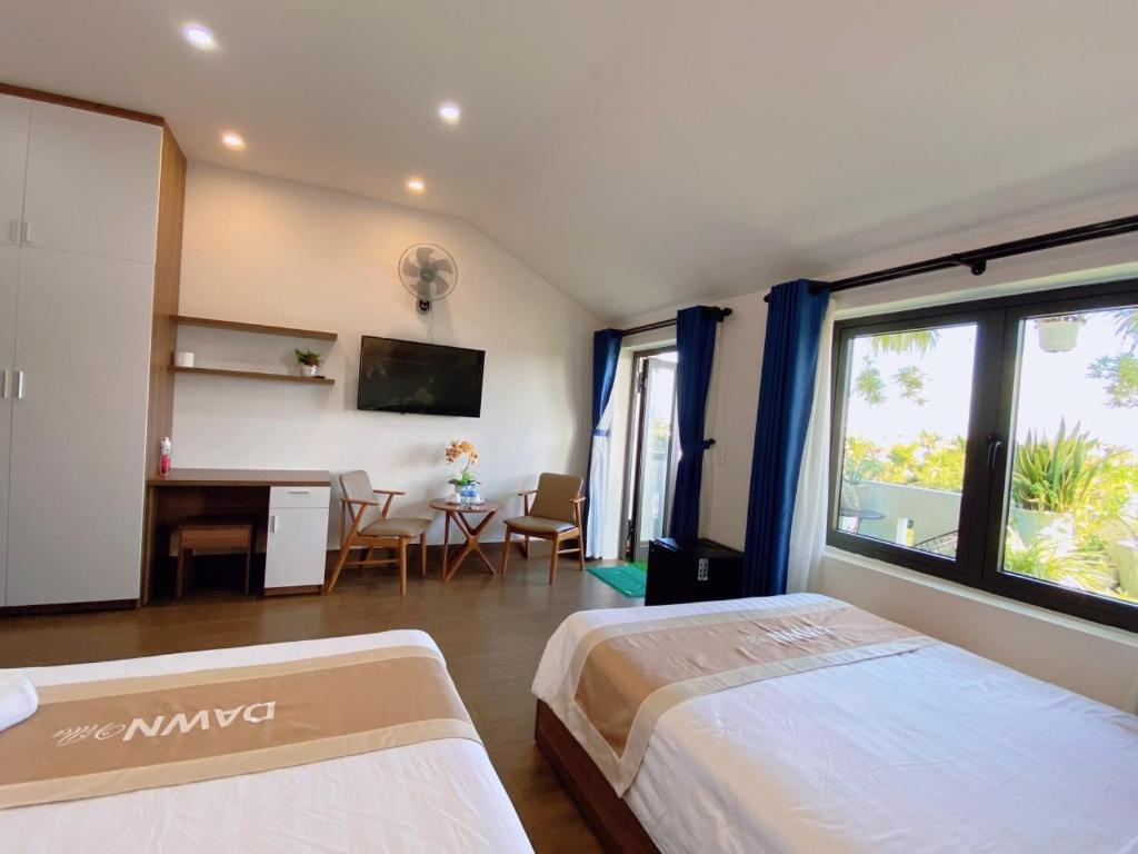 Postel nebo postele na pokoji v ubytování Dawn Villa Homestay Hội An