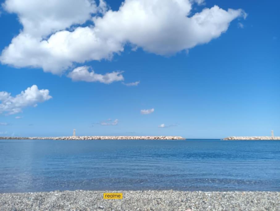 a view of the ocean with a blue sky and clouds at SeãCret in Kolymvari