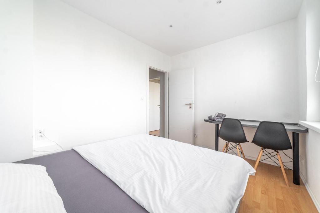 A bed or beds in a room at AR Rezidencia Ludmanská