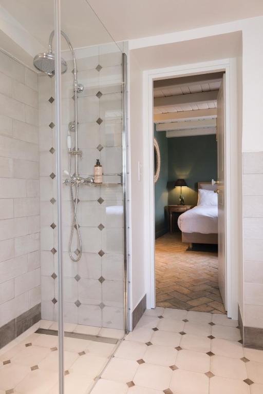 Postel nebo postele na pokoji v ubytování L'Abbaye Hôtel