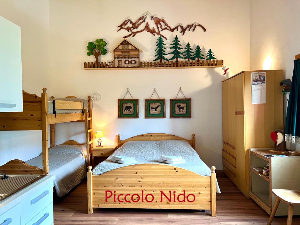 Posteľ alebo postele v izbe v ubytovaní Piccolo Nido Falcade