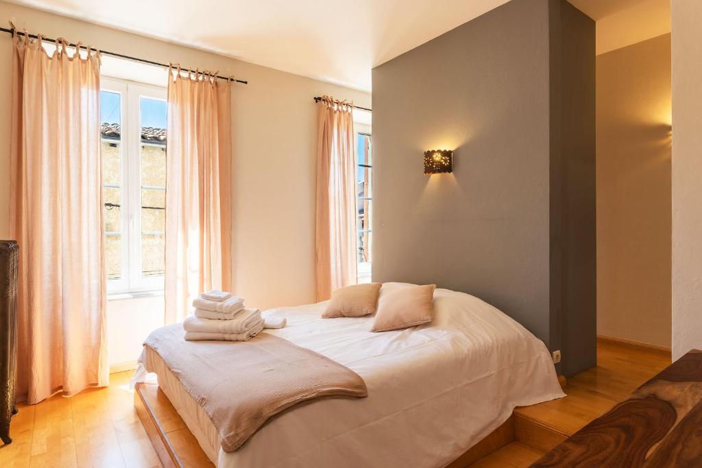 Postel nebo postele na pokoji v ubytování Le Gîte du Carmel