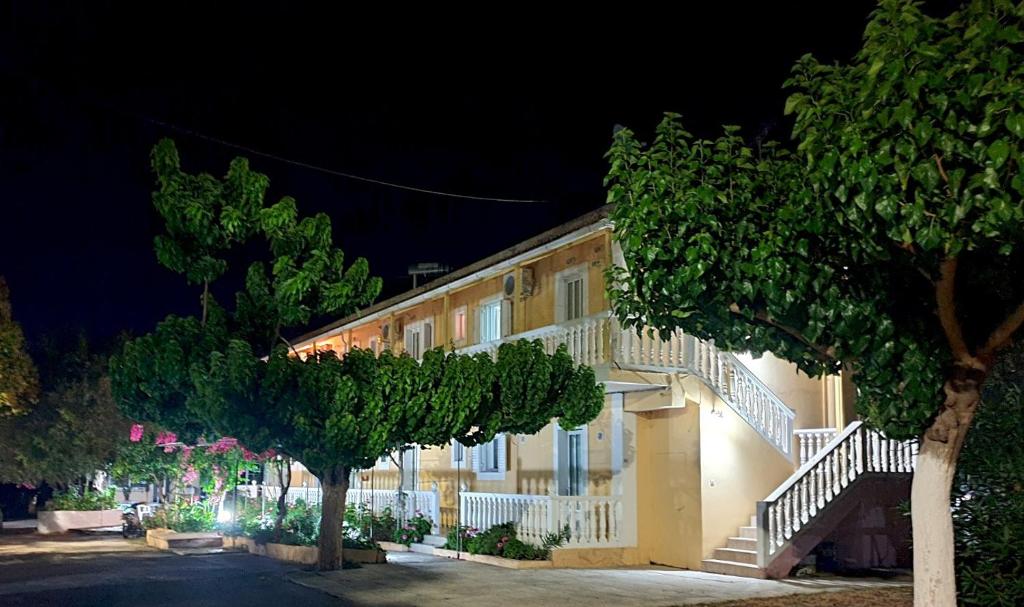 a building at night with trees in front of it at Casa Dyonisia Tsilivi in Plános