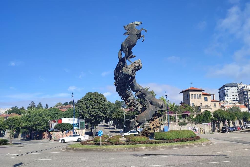 a statue in the middle of a street at Estudio céntrico, a pocos metros Plaza de España. in Vigo