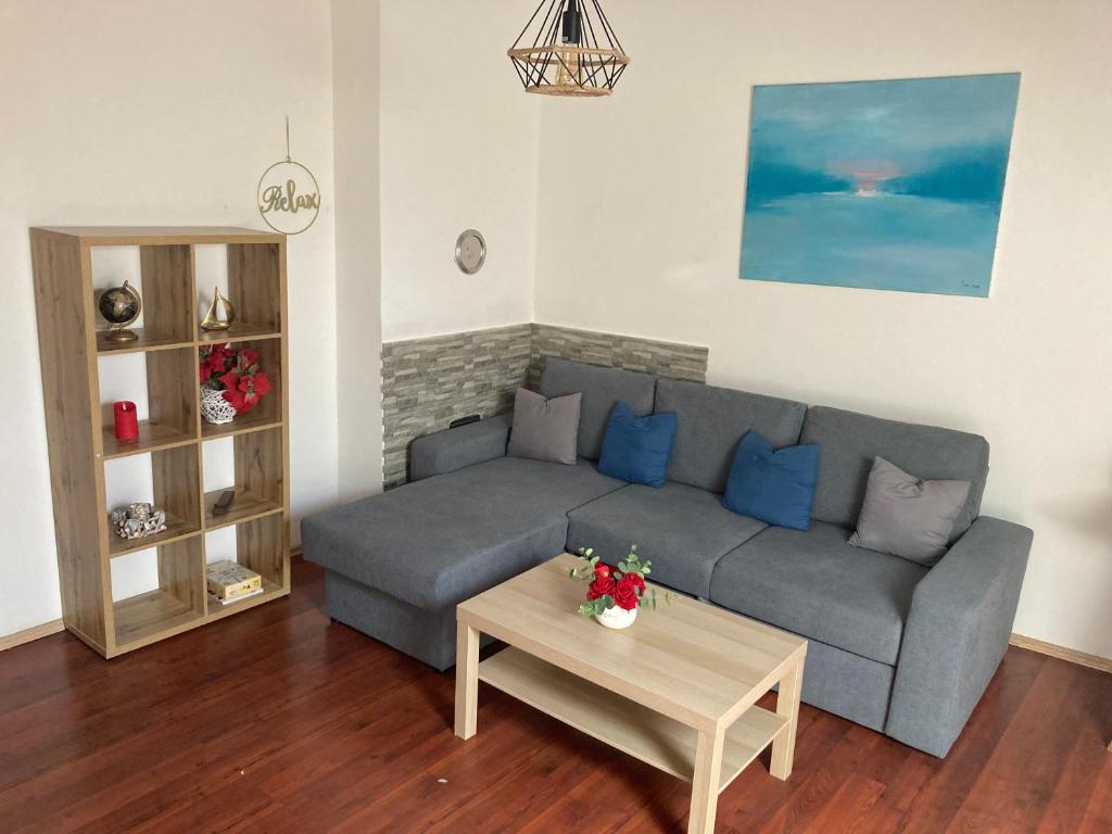 a living room with a couch and a coffee table at Rijeka city center apartment in Rijeka