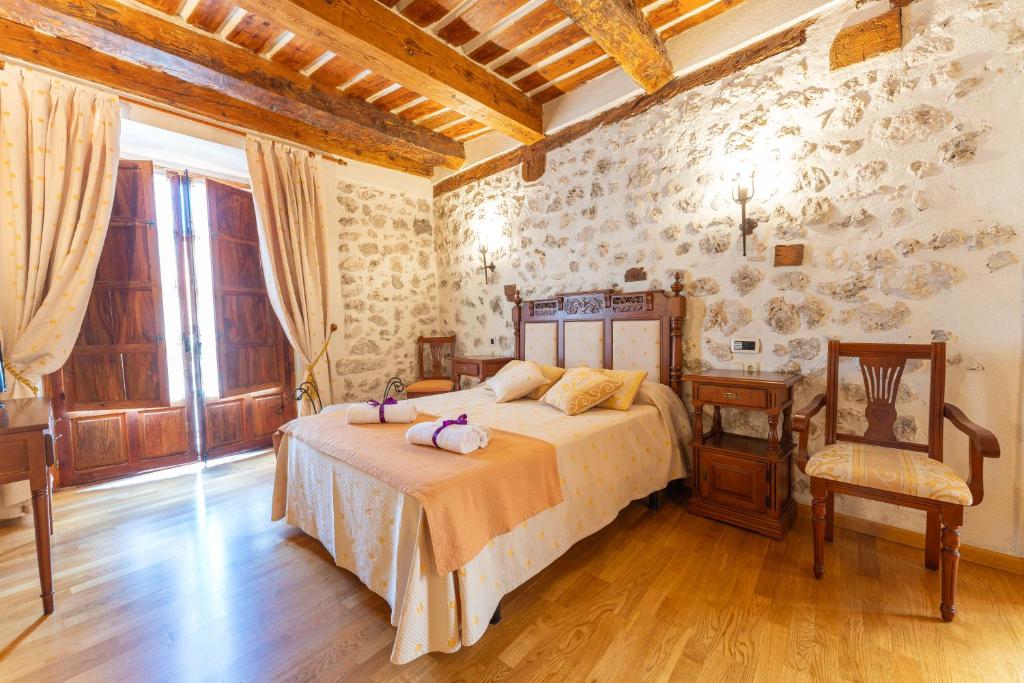Postel nebo postele na pokoji v ubytování Hotel Rincón Castellano