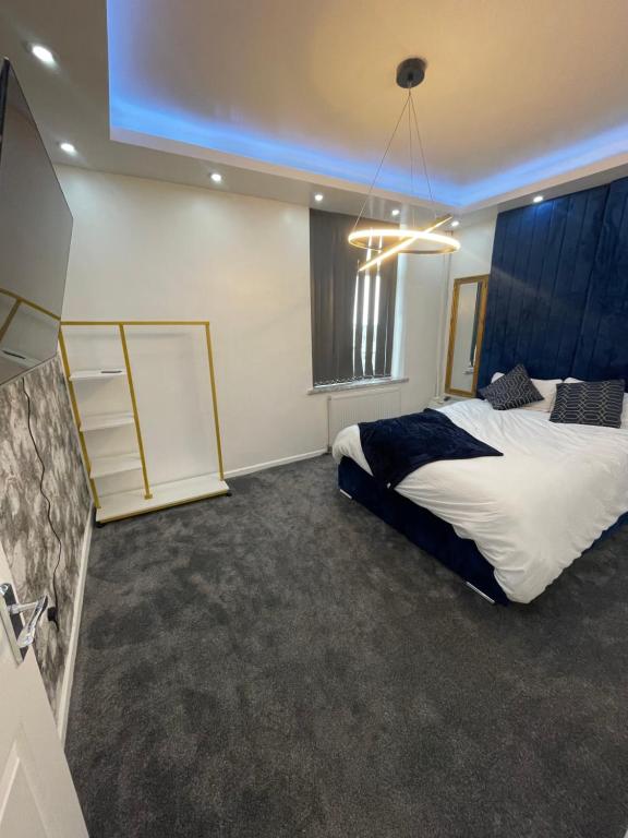 a bedroom with two beds and a large window at Lumiere luxury apartment 