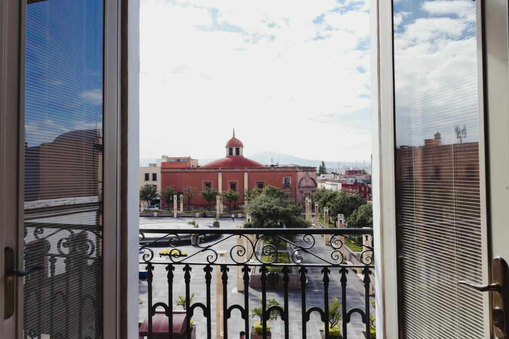 a view of a city from a balcony at Gran Hotel de Querétaro in Querétaro