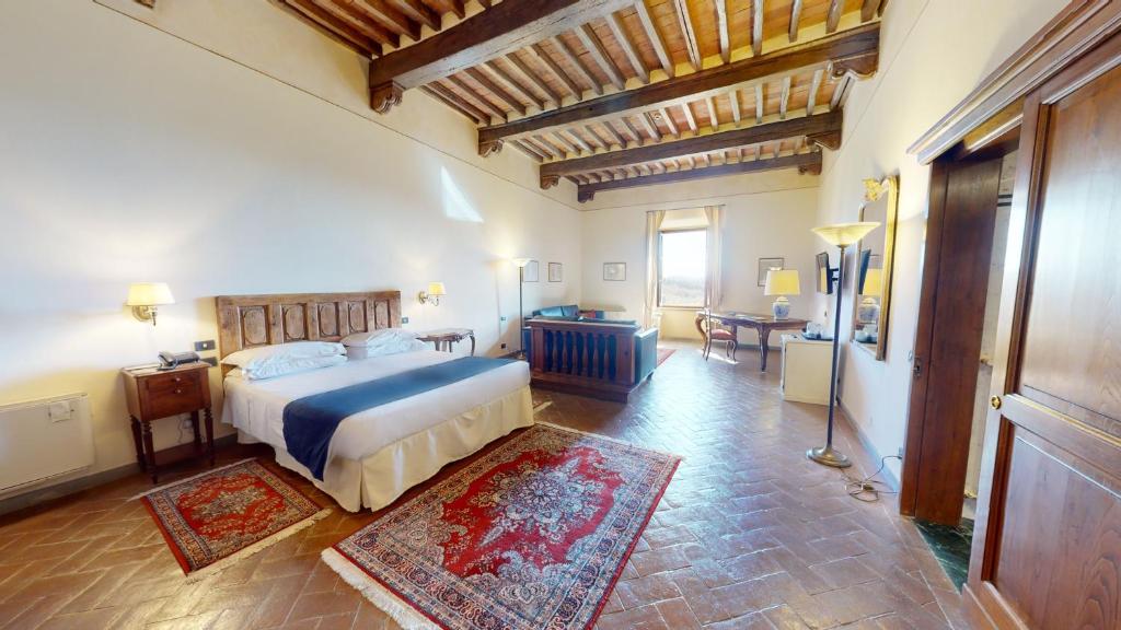 Postel nebo postele na pokoji v ubytování Hotel Palazzo Squarcialupi