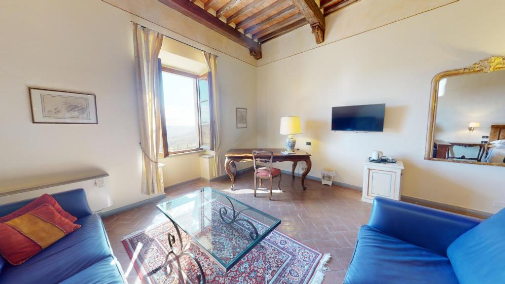 TV a/nebo společenská místnost v ubytování Hotel Palazzo Squarcialupi