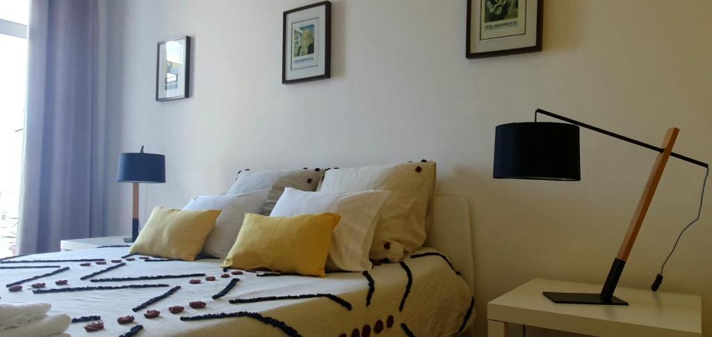 Postel nebo postele na pokoji v ubytování A-Típica GuestHouse