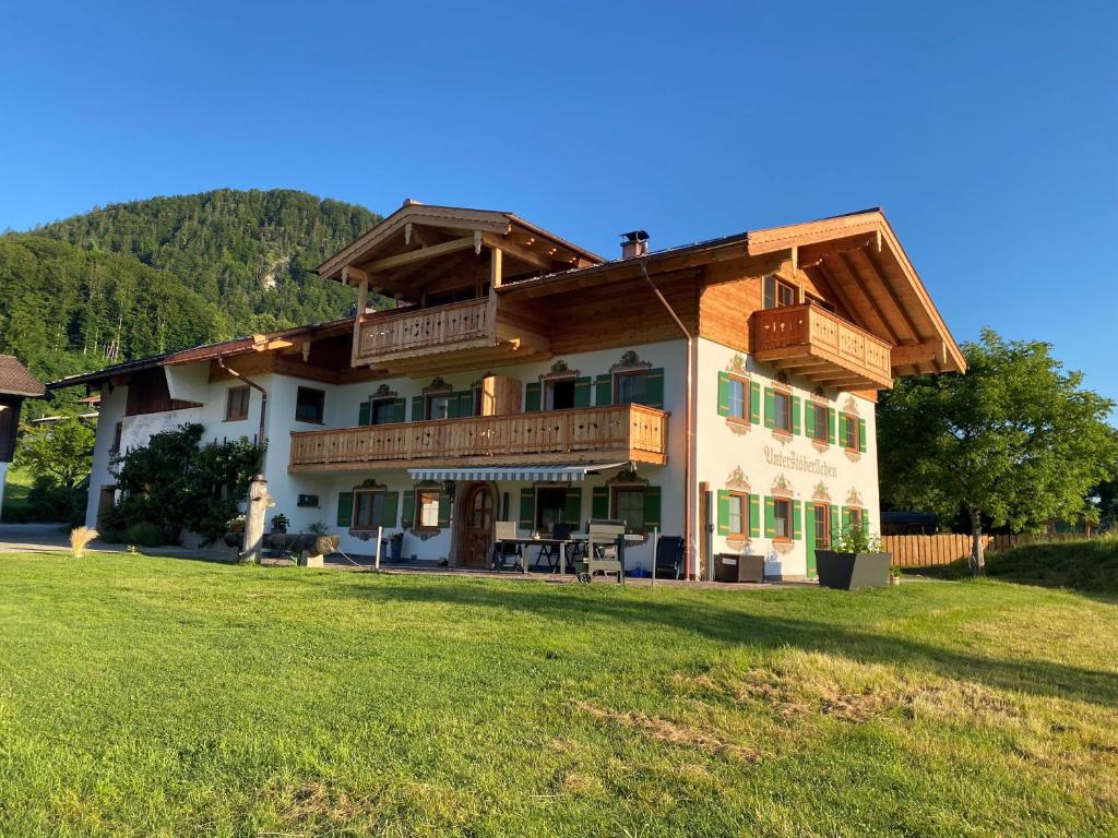 a large house with a large yard in front of it at Haus Unterstöberl in Bischofswiesen