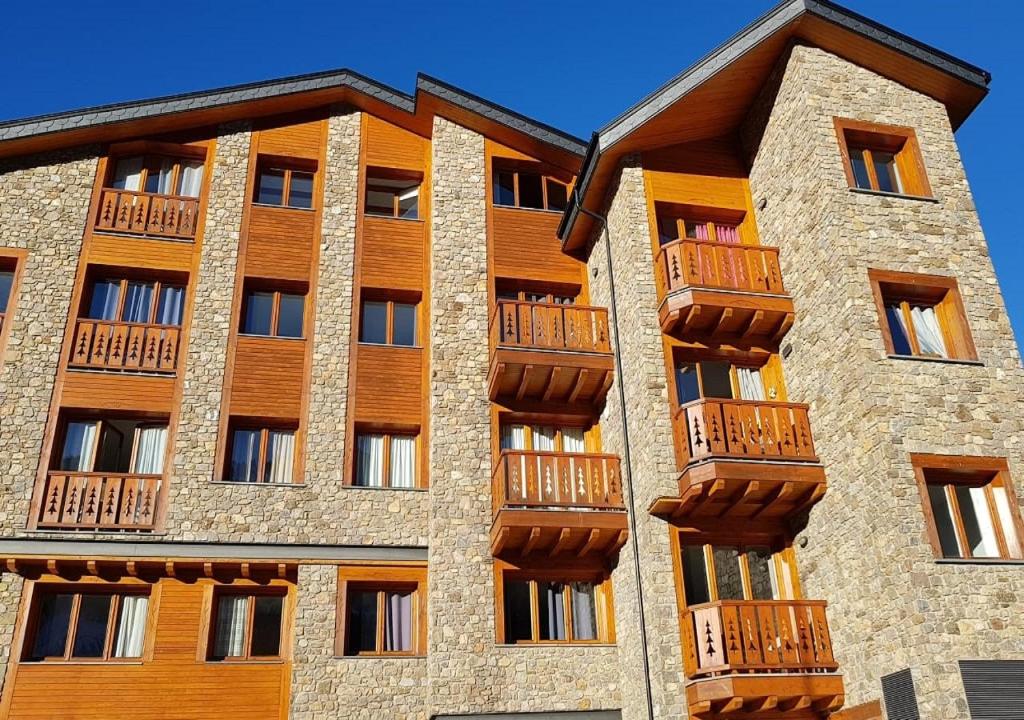 a building with balconies on the side of it at Esfera turística,Tarter Park in El Tarter