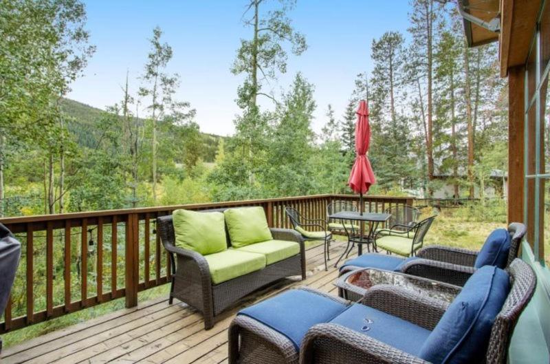 a deck with furniture and a table and chairs at Lovely Townhome A Half-mile From Keystone Gondola W-shared Hot-tub Excellent Views, in Dillon