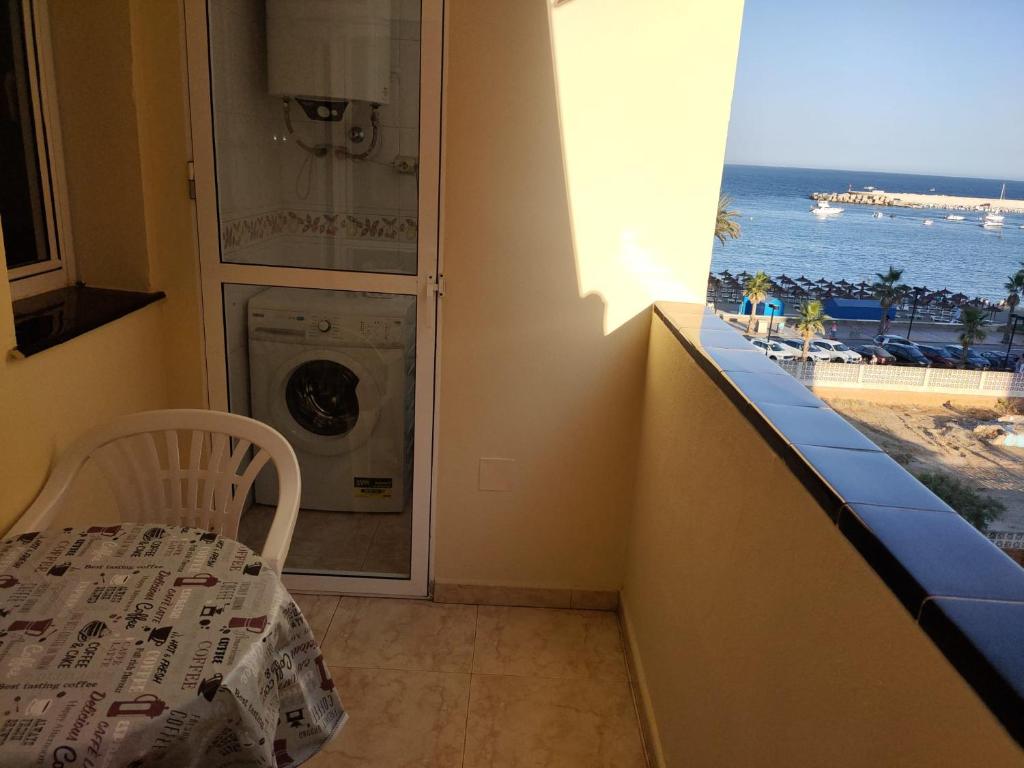 a laundry room with a view of the ocean at HC Fuengirola Playa Apartamento in Fuengirola