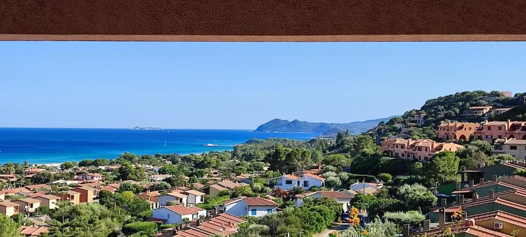 a view of a town with houses and the ocean at Villa Milena Costa Rei VISTA MARE in Costa Rei