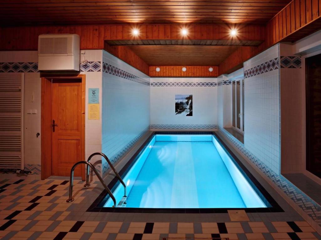 a indoor swimming pool in a house at Apartmány Braníčkov in Branickov
