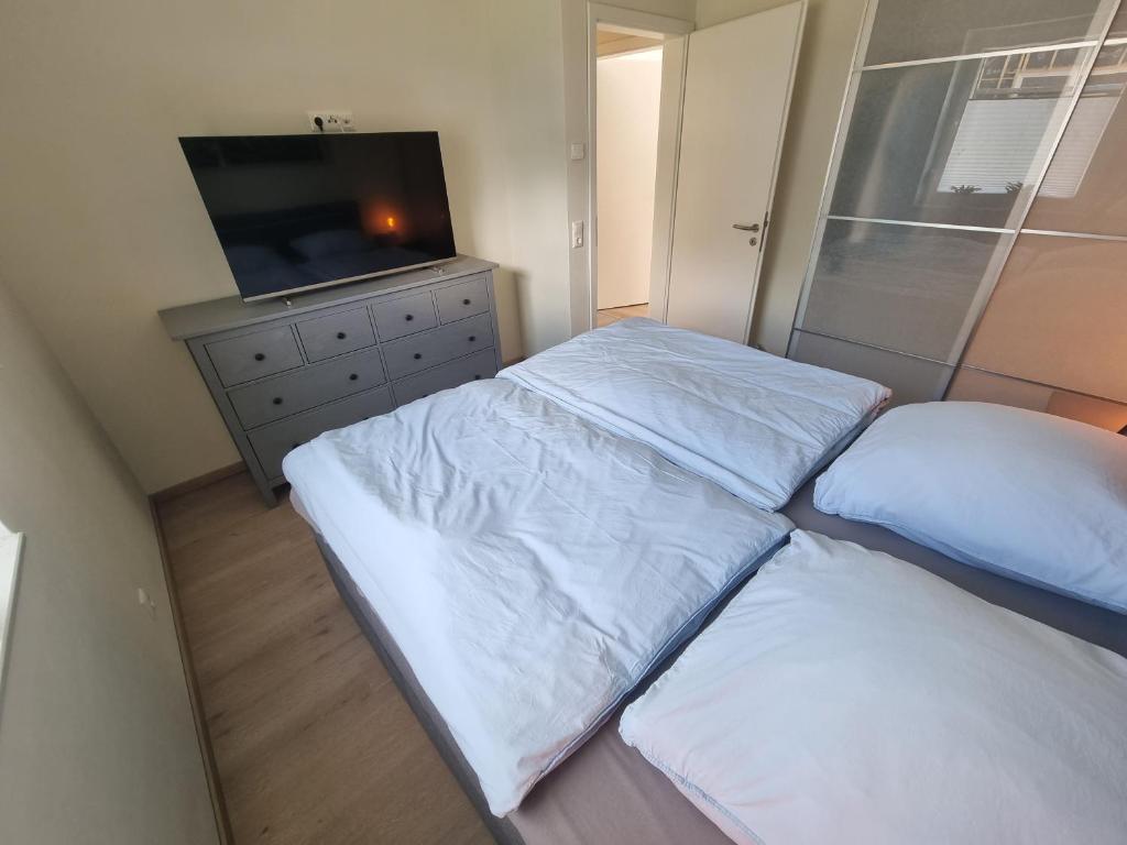 Postel nebo postele na pokoji v ubytování Ferienhaus am Bernsteinsee