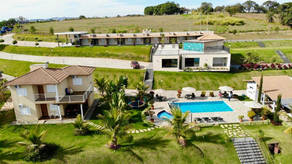 an aerial view of a house with a swimming pool at Pousada Dona Tereza in Guapé