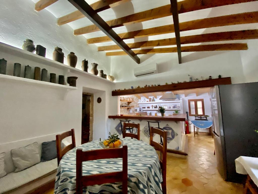 A kitchen or kitchenette at Rural Charm villa and Outdoor Adventure Agritourism Apartment with Private Mountain Path approximately 5 minutes walking from the beach Ideal for relaxation