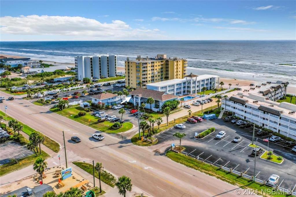 an aerial view of a city and the ocean at Coastal Life 206 - A 2nd Floor Studio With 2 Single Beds in New Smyrna Beach