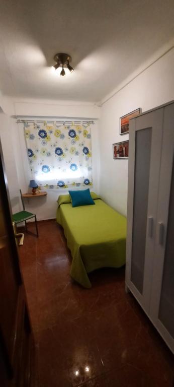 Łóżko lub łóżka w pokoju w obiekcie Apartamento Jose Maria Corona