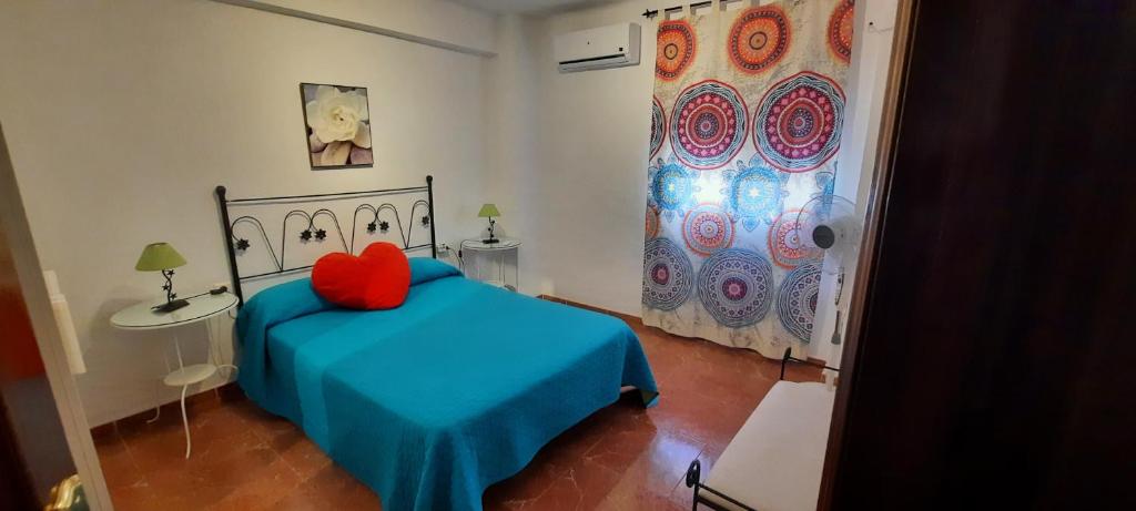 Łóżko lub łóżka w pokoju w obiekcie Apartamento Jose Maria Corona