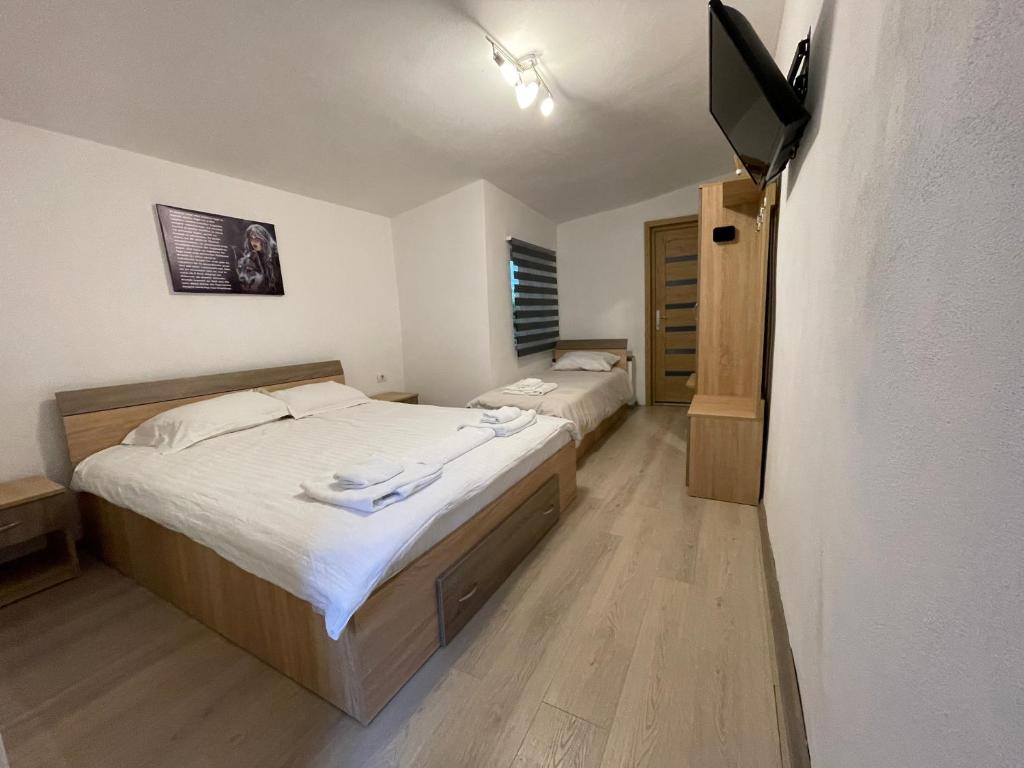 Postel nebo postele na pokoji v ubytování Casa Lupilor Transfăgărășan