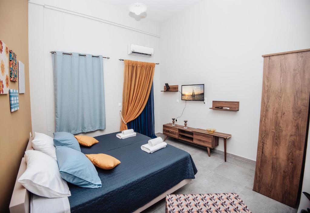 Postel nebo postele na pokoji v ubytování Lithos apartments