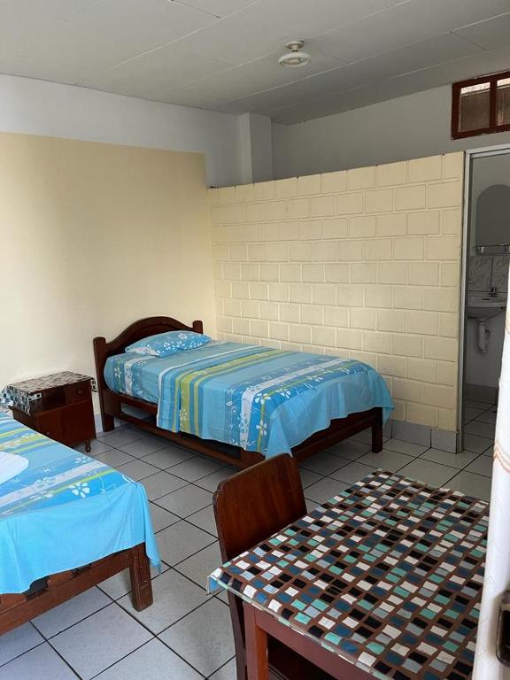 Кровать или кровати в номере Alojamiento Grau