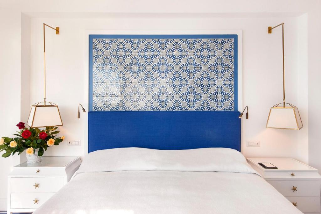 Postel nebo postele na pokoji v ubytování Il San Pietro di Positano