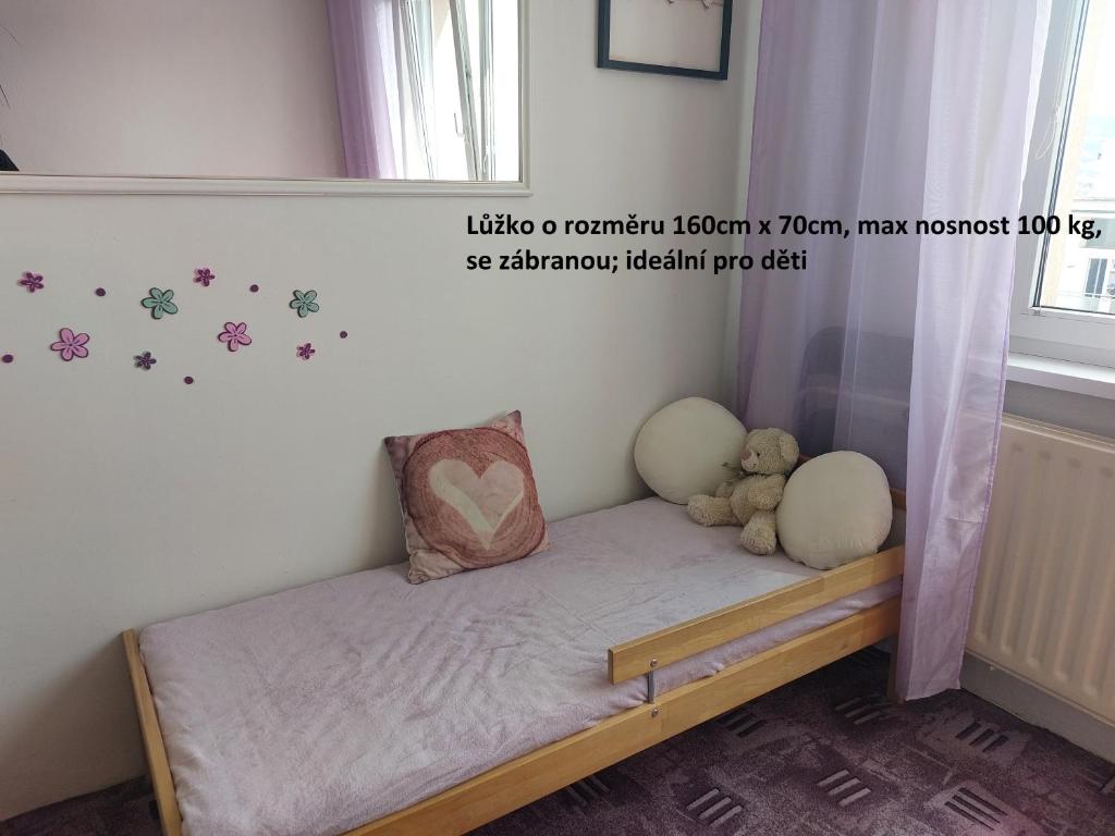 Postel nebo postele na pokoji v ubytování Apartmán v podhůří Krušných hor