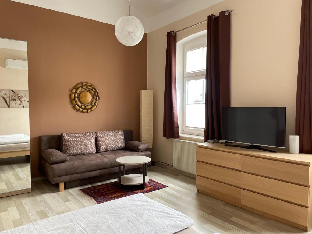 TV a/nebo společenská místnost v ubytování Stadtapartment WOHNEN48.AT