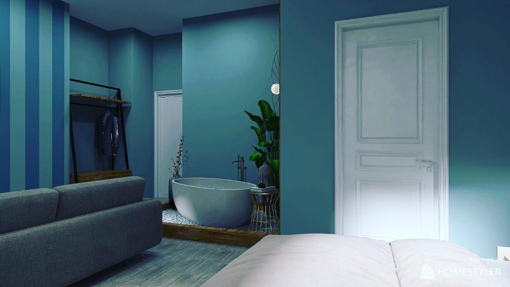 a bedroom with a blue wall with a tub and a couch at RESIDENZA 62 in Rome