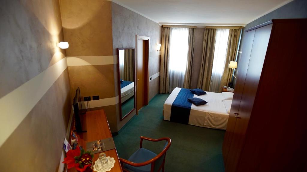 Postel nebo postele na pokoji v ubytování Classic Hotel Tulipano