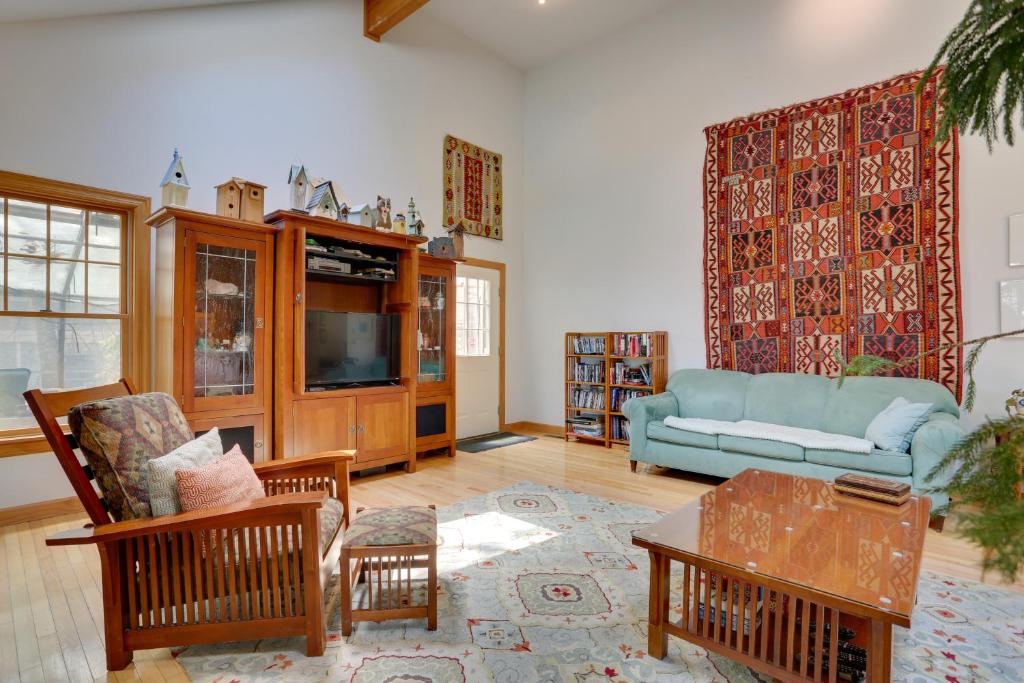 a living room with a couch and a table at Tannersville Vacation Rental with Pool Table! in Tannersville