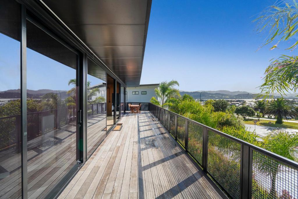 a balcony of a house with a view at Panorama Vista in Pauanui