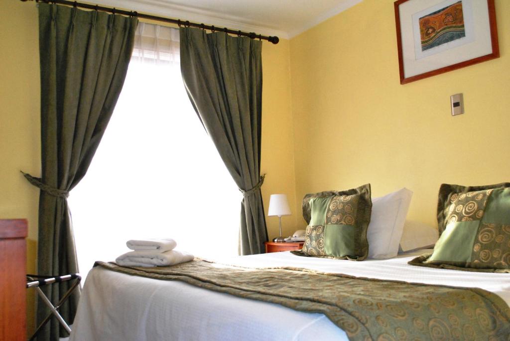 Postel nebo postele na pokoji v ubytování Hotel Carpa Manzano