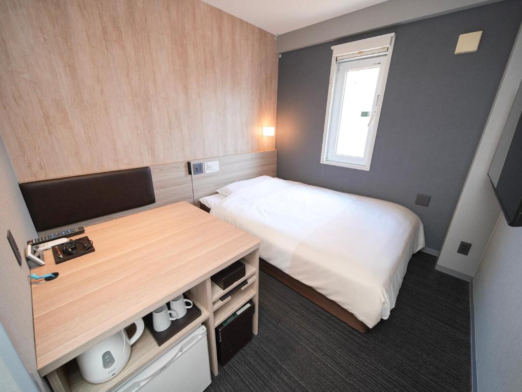 Postel nebo postele na pokoji v ubytování Super Hotel Hiroshima