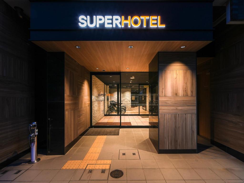 a building with a sign that reads super hotel at Super Hotel Hiroshima in Hiroshima