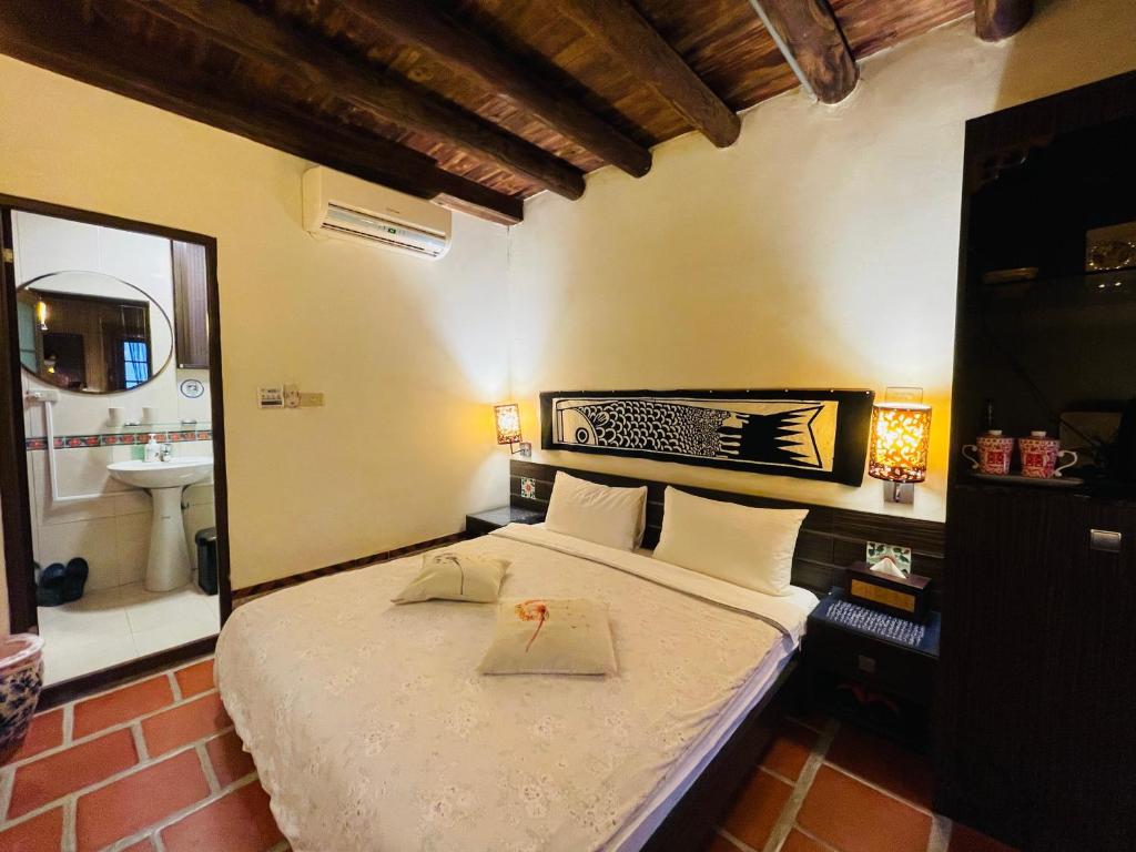 Postel nebo postele na pokoji v ubytování Grace Kinmen B&B