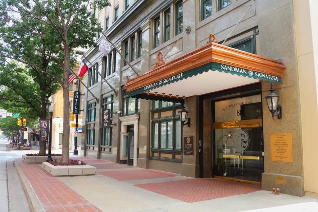 a store front of a building on a city street at Sandman Signature Fort Worth Downtown Hotel in Fort Worth