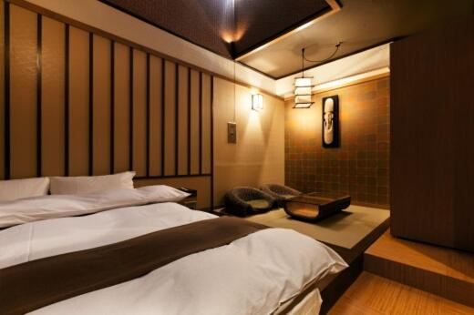 Postel nebo postele na pokoji v ubytování HOTEL GEN 福知山店