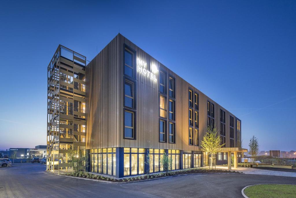 a rendering of a building in a parking lot at MYHOTEL München Olching in Olching