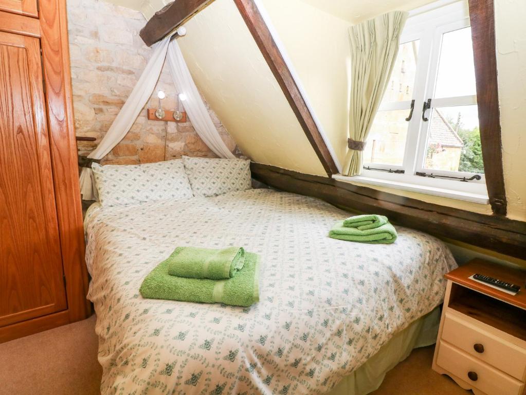Postel nebo postele na pokoji v ubytování Hadcroft Cottage